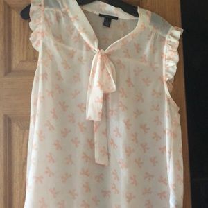 White blouse with pink bow pattern